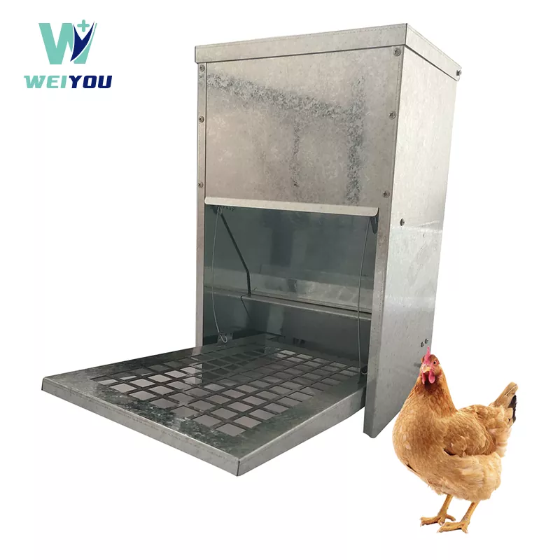 Poultry treadle trough feeder